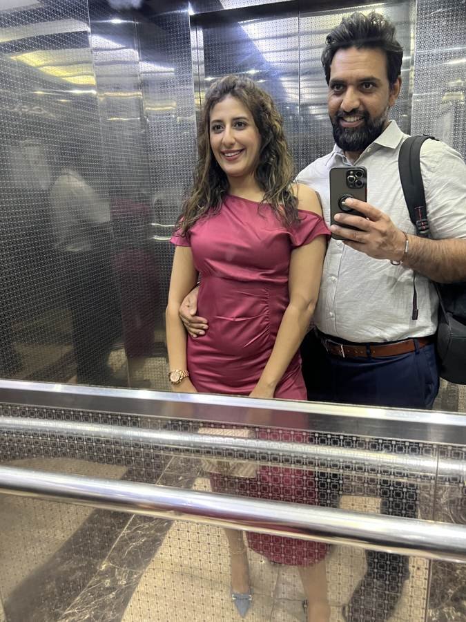 elevator mirror, magenta dress