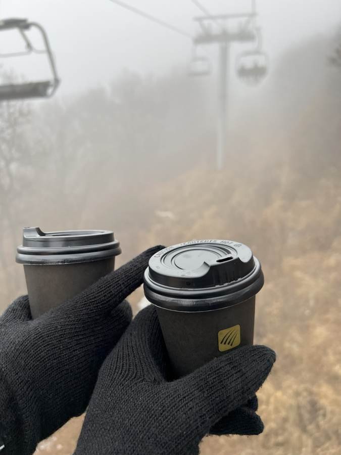 two coffees, one very foggy view